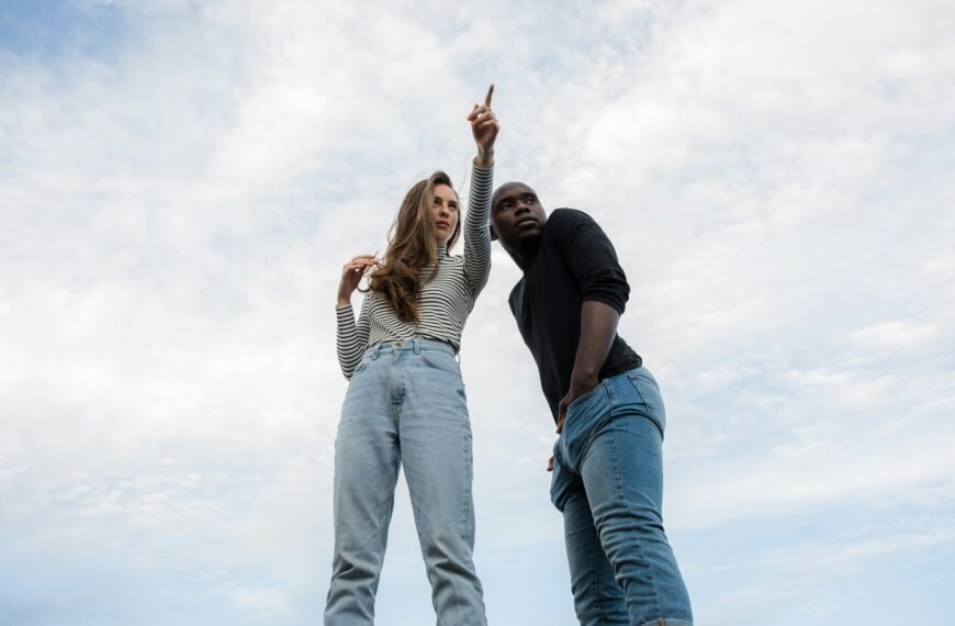 photography of woman pointing her finger near an man